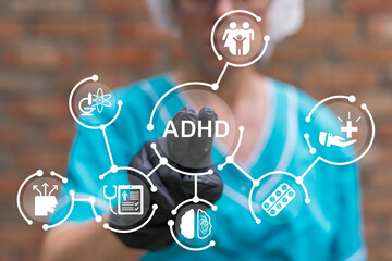 Doctor using virtual touch screen presses abbreviation: ADHD. Attention Deficit Hyperactivity Disorder ( ADHD ) medical cocnept. ADHD syndrome, mental health, psychology. - obrazy, fototapety, plakaty