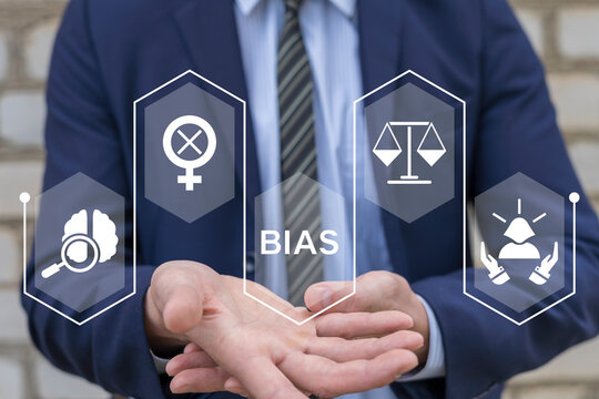 Man using virtual screen sees word: BIAS. Bias model or implicit bias drives our explicit behavior, perspective and decisions with mindfulness, consciousness, preconscious, feeling, unconscious bias.