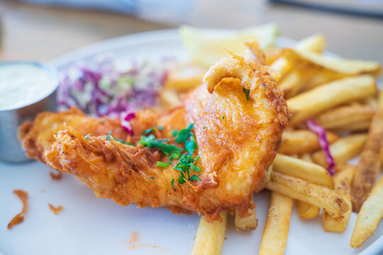 Fish and chip, a common dish for Americans or European. Fish is covered with flour then deep fried. It is served with fried potatoes or chips. Eat with ketchup or hot sauce.