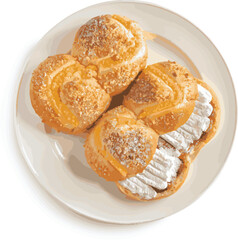 The traditional French dessert, cream puff or profiteroles. They are choux pastry balls covered in powdered sugar and filled with thick, sweet cream. Whipping cream can be used in place of cream