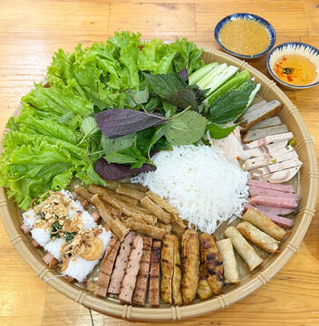 Bun dau mam tom or Vermicelli with shrimp paste. A traditional Northern Vietnamese dish. It has distinct smells that only locals can enjoy. It is a combination plate with cooked pork ribs, fried tofu,