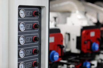 pressure gauges and regulators on control panel