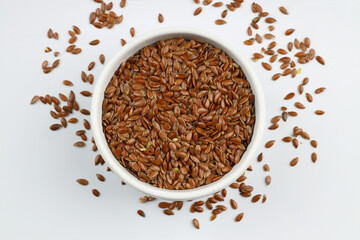 Pile of flax seeds isolated on white background