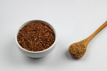 Pile of flax seeds isolated on white background