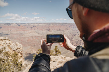 person taking photo grand canyon photographer 
