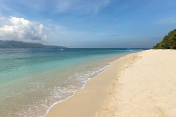 Turquoise water and pure white sand beach at the shore of famous Gili meno island in Lombok,...