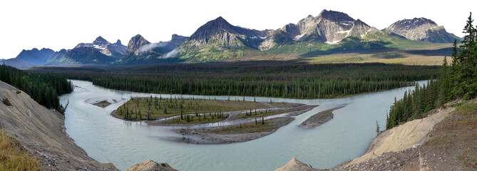 Panoramic view of a large pale green mountain river and a rocky mountain range with a forest in the midground. The sky is transparent.
