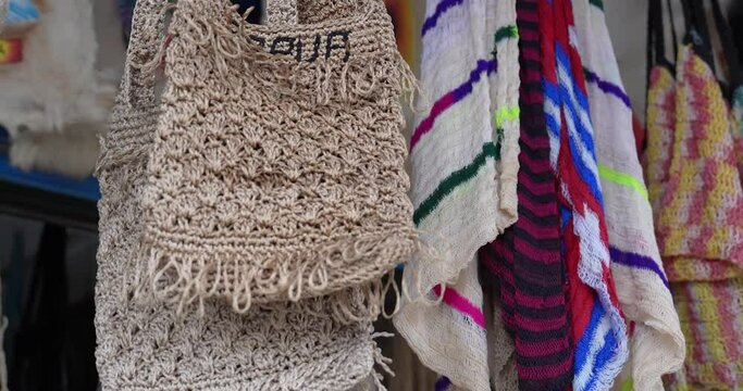 Jayapura, Papua-Indonesia, December 2023: Typical Papuan handicrafts as souvenirs that can be purchased by tourists in the form of thread nokens, bark nokens and koteka. You can get it at the Hamadi 