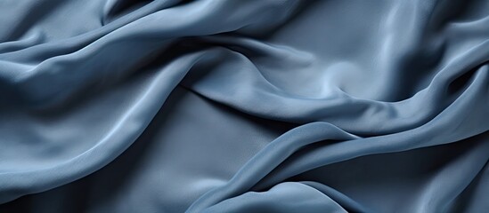 Obraz premium Close-up image showing the texture of a smooth blue silk fabric with a soft feel and vibrant color