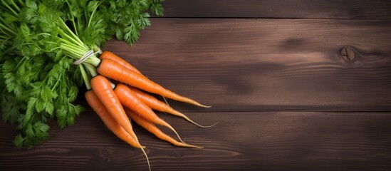 Fresh orange carrots arranged neatly on a weathered wooden table, creating a simple and natural composition - obrazy, fototapety, plakaty