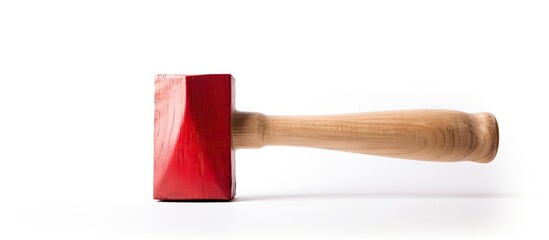 A hammer is placed on a flat surface like a table, showing its metallic texture and sturdy construction