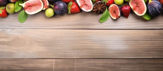 Various fresh fruits like apples, oranges, and bananas arranged on a textured wooden table surface