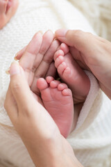 Obraz na płótnie Canvas Little newborn baby feet portrait photography