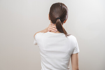 Pain body muscles stiff problem, asian young woman, girl painful with back, neck ache from work hand holding massaging rubbing shoulder hurt, sore on white background. Health care and medicine concept
