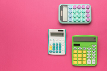 A set of calculators on a red background with space for text.