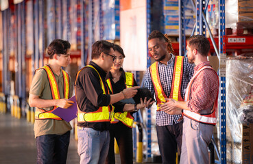 A group of warehouse employees, Inspecting products on warehouse shelves before they are sent to retailer - obrazy, fototapety, plakaty