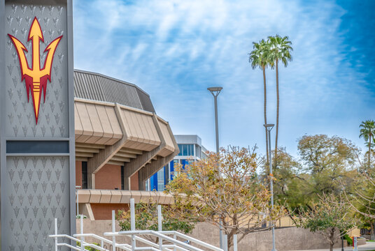 Phoenix, Arizona, USA - 3.23.2024: Focus on Sundevil logo with distant view of Arizona State University Desert Financial Arena