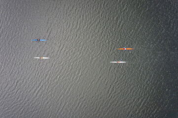 Kayaking top view. Group of kayaks rowing. Aerial view from drone.
