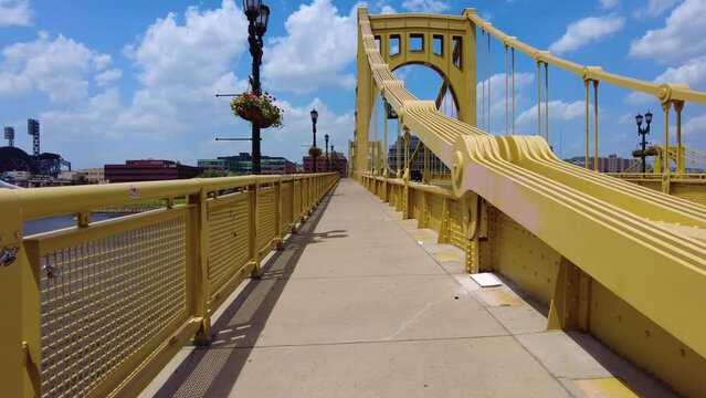 Walking over a bridge away from downtown Pittsburgh.
