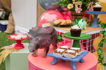 Snacks and cake table full of sweets and sandwiches Toddler girl Birthday celebration party decoration