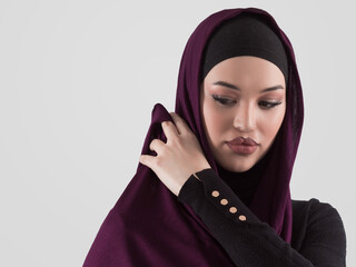 Muslim woman wearing modern stylish wear and hijab isolated on grey background. Diverse people model hijab fashion concept. - 781030349
