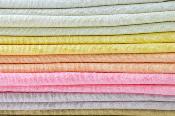 stack of colourful cotton clothes, close up pile of clothing - 781031330