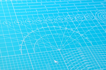 blue cutting mat board background with line and scale measure guide pattern for object art design,...