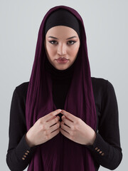 Muslim woman wearing modern stylish wear and hijab isolated on grey background. Diverse people model hijab fashion concept. - 781037771