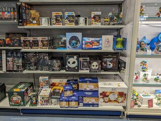 Obraz premium France, 16 March 2024: Collectibles and Toy Figurines on Display Shelves.