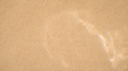 Yellow clean sand with wavy patterns under clear water.