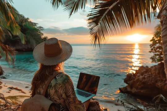 Female freelancer with laptop on the beach during sunset. Place of work of a hermit freelancer. The sunset paints a backdrop for the hermit freelancer's focused productivity.