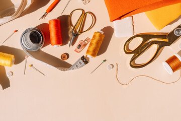 Various working tools and sewing materials on a light background.