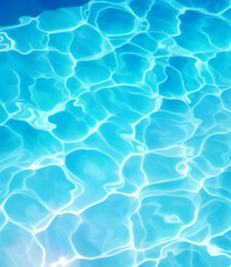 A photo of bright blue water in the pool, with ripples and reflections on its surface. This is a top-down view of the swimming pool, focusing only on its clear blue color. water under sunlight