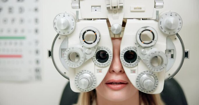 Woman, phoropter and eye test with optometrist for vision with refraction consultation or prescription glasses. Patient, optical tool and ophthalmology for retina strength, lens check and discussion