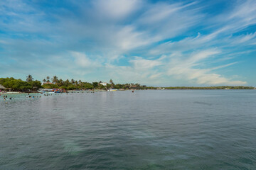 Palma island seen from a boat with sea and blue sky. San Bernardo Colombia. 