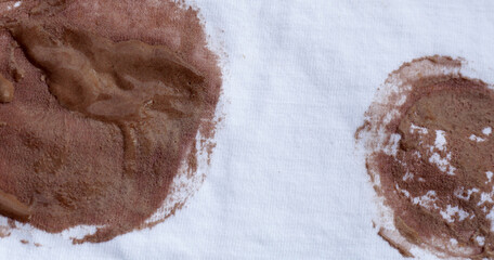 Dirty stain chocolate ice cream  on white clothes