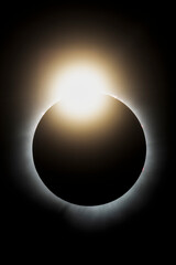 The last light from the sun peaks out before it is completely covered by the moon during the total solar eclipse on April 4, 2024. This look is called the diamond ring effect.