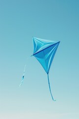 A blue kite soaring high in the sky, suitable for various outdoor activities promotions
