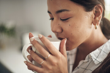 Woman and drinking cup of coffee at home in the kitchen with caffeine for breakfast. Female person, beverage and enjoying fresh, brewed drink and morning fix to feel energy, relaxed and refreshed - obrazy, fototapety, plakaty