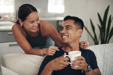 Relax, smile and couple on couch with coffee, bonding and happy relationship together in home on...