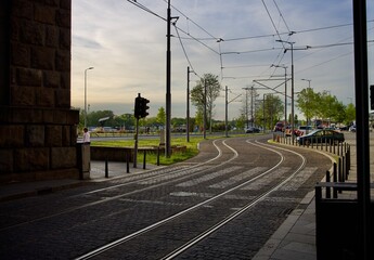 station at night. tram tracks in the city against the background of the evening sky. railway line bend - Powered by Adobe