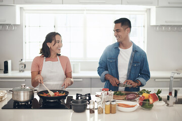 Love, cooking and happy couple in kitchen together with healthy food, relationship and bonding in...