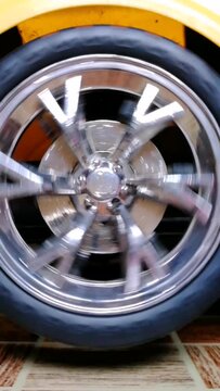 Car wheel spinning. Black tire with silver rim rolling very fast. Best intro clip for racing, car presentation, branding,  rally competition etc