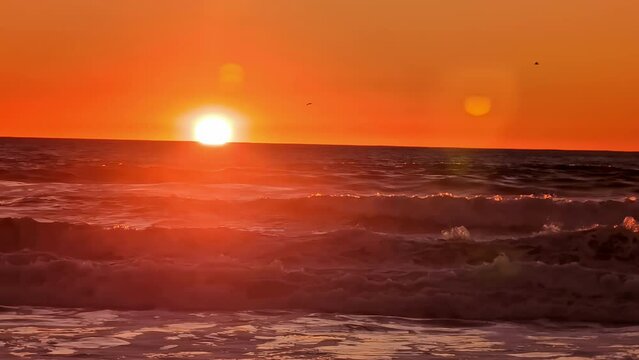 Sunset sunrise wonderful nature bright orange sky sun over ocean sea water