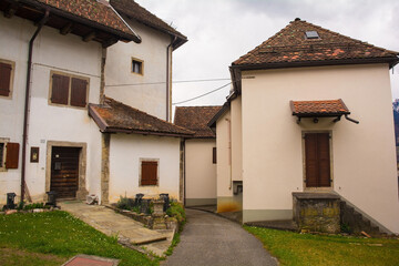 Historic residential buildings in the mountain village of Ovasta in Carnia, Udine Province,...