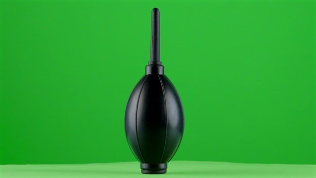 photography videography blower rocket soft air enema on green background chroma key background replacement backdrop objet in a turntable 3d spinning loop