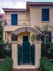 A contemporary design house entrance with a dark blue-green door at upscale suburbs of Athens. Travel in Greece. - 781087309