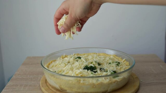 The pie Quiche Lorraine is sprinkled with cheese on top  