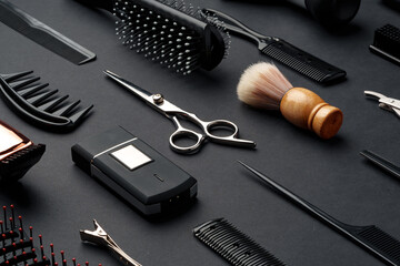 Variety of Hair Styling Tools and Accessories Displayed on a Dark Background