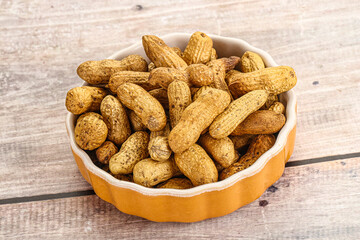 Raw ripe unpeeled peanut heap